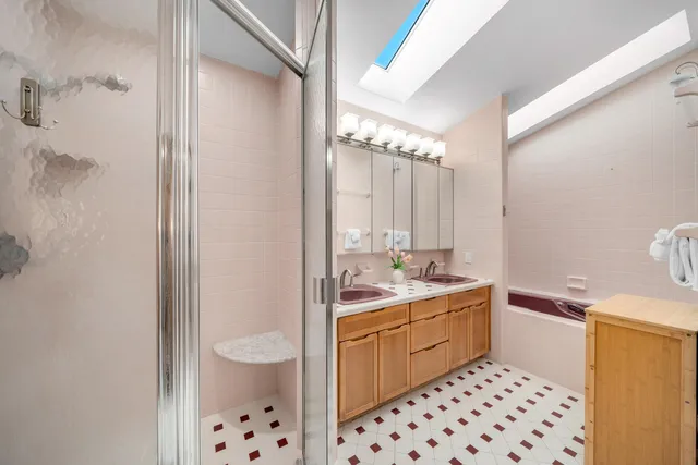 a view of a patio with table and chairs under an umbrella
