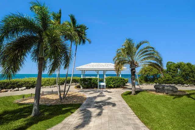 a view of a chairs and table in patio