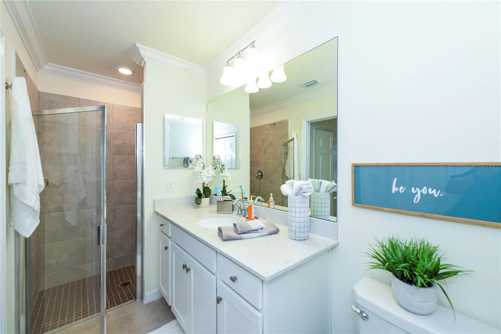17810 Gawthrop Drive, Unit 101 Lakewood Ranch, FL 34211 - Photo 13 of 53 a spacious bathroom with a granite countertop sink and a mirror