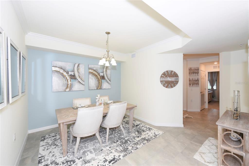 17810 Gawthrop Drive, Unit 101 Lakewood Ranch, FL 34211 - Photo 17 of 53 a view of a dining room with furniture