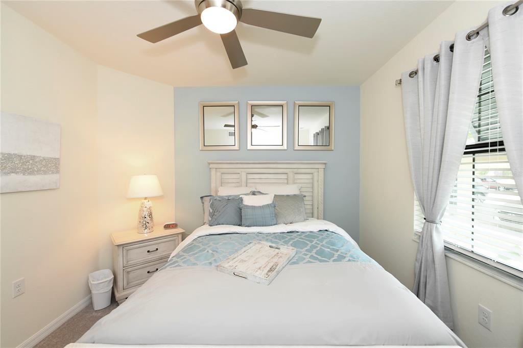 17810 Gawthrop Drive, Unit 101 Lakewood Ranch, FL 34211 - Photo 24 of 53 a bedroom with a large bed and a window