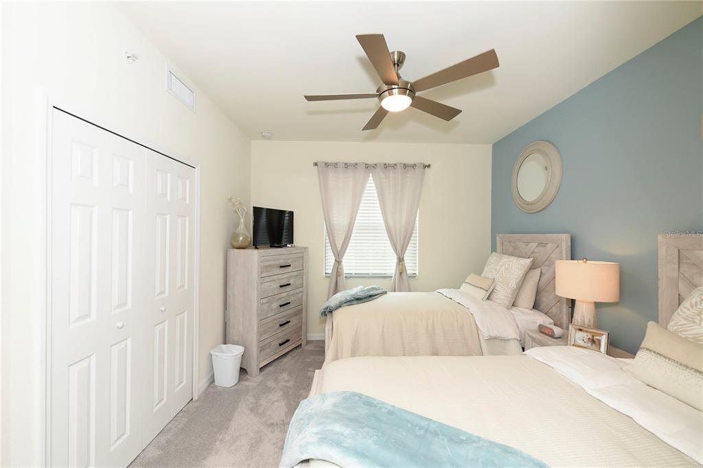 17810 Gawthrop Drive, Unit 101 Lakewood Ranch, FL 34211 - Photo 25 of 53 a bedroom with a large bed and a window