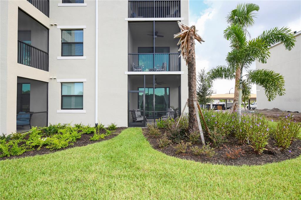 17810 Gawthrop Drive, Unit 101 Lakewood Ranch, FL 34211 - Photo 30 of 53 a view of a garden in front of a house