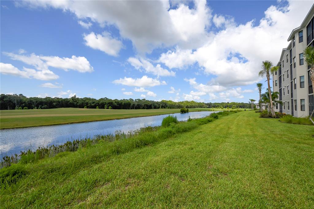 17810 Gawthrop Drive, Unit 101 Lakewood Ranch, FL 34211 - Photo 32 of 53 a view of a lake with a city