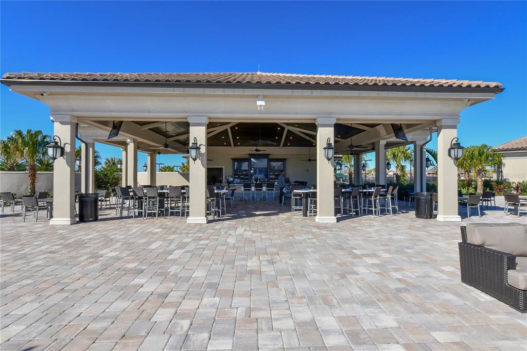17810 Gawthrop Drive, Unit 101 Lakewood Ranch, FL 34211 - Photo 45 of 53 a view of a house with porch and outdoor seating