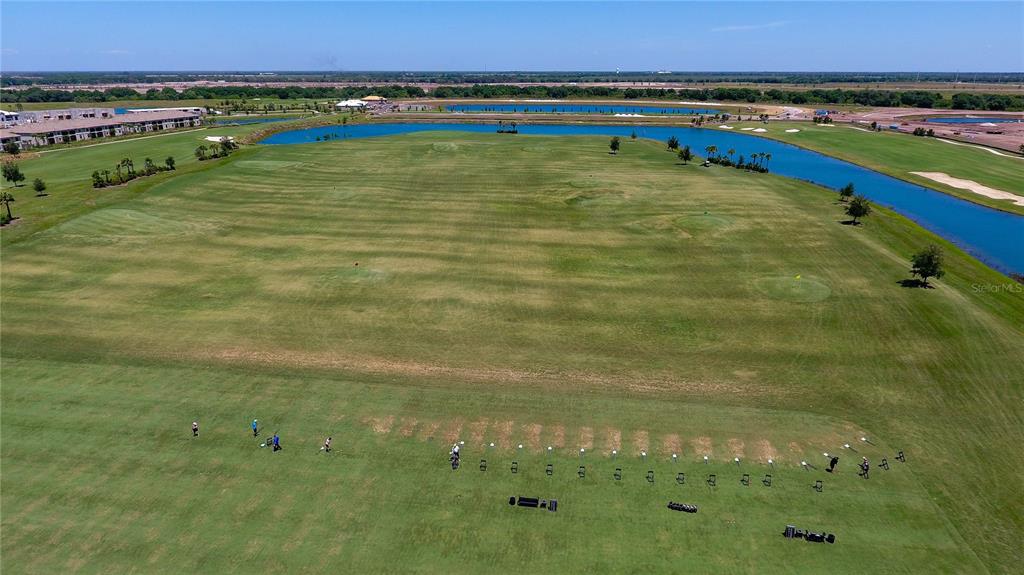 17810 Gawthrop Drive, Unit 101 Lakewood Ranch, FL 34211 - Photo 52 of 53 a view of a large pool with a yard and mountain view