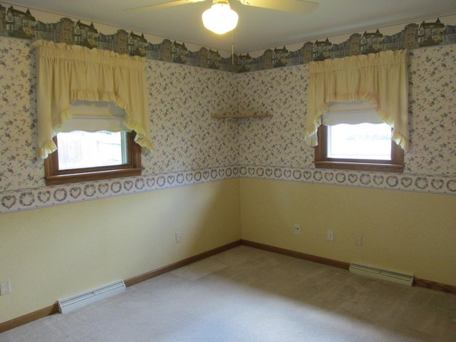 708 South Cooper Road New Lenox, IL 60451 - Photo 13 of 24 an empty room with a window