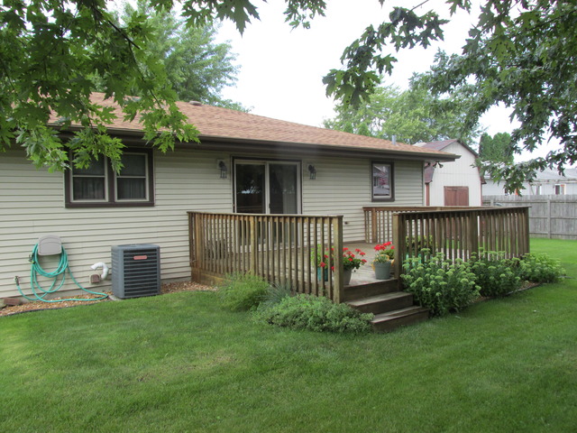 708 South Cooper Road New Lenox, IL 60451 - Photo 24 of 24 a front view of a house with a garden