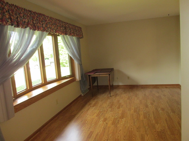 708 South Cooper Road New Lenox, IL 60451 - Photo 8 of 24 a view of an empty room with a window
