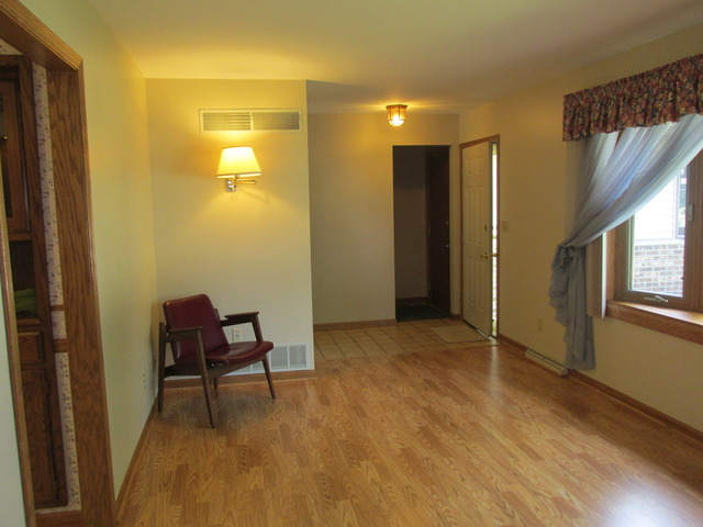 708 South Cooper Road New Lenox, IL 60451 - Photo 9 of 24 a view of a room with furniture and wooden floor