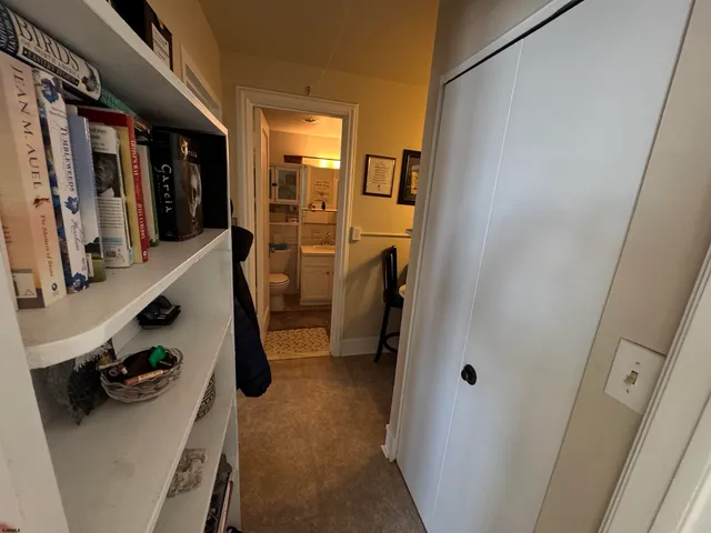 a kitchen with granite countertop a sink stove and cabinets