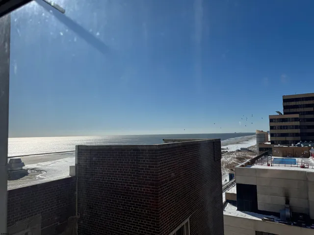 a living room with furniture a couch and a chandelier