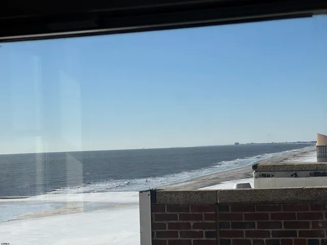 a kitchen with stainless steel appliances granite countertop a stove and a refrigerator
