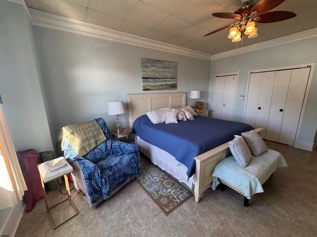 a bedroom with furniture and a window