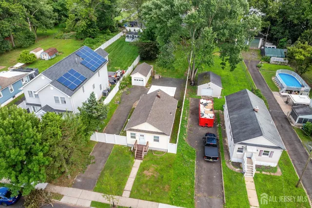 a view of a house with a yard and sitting area