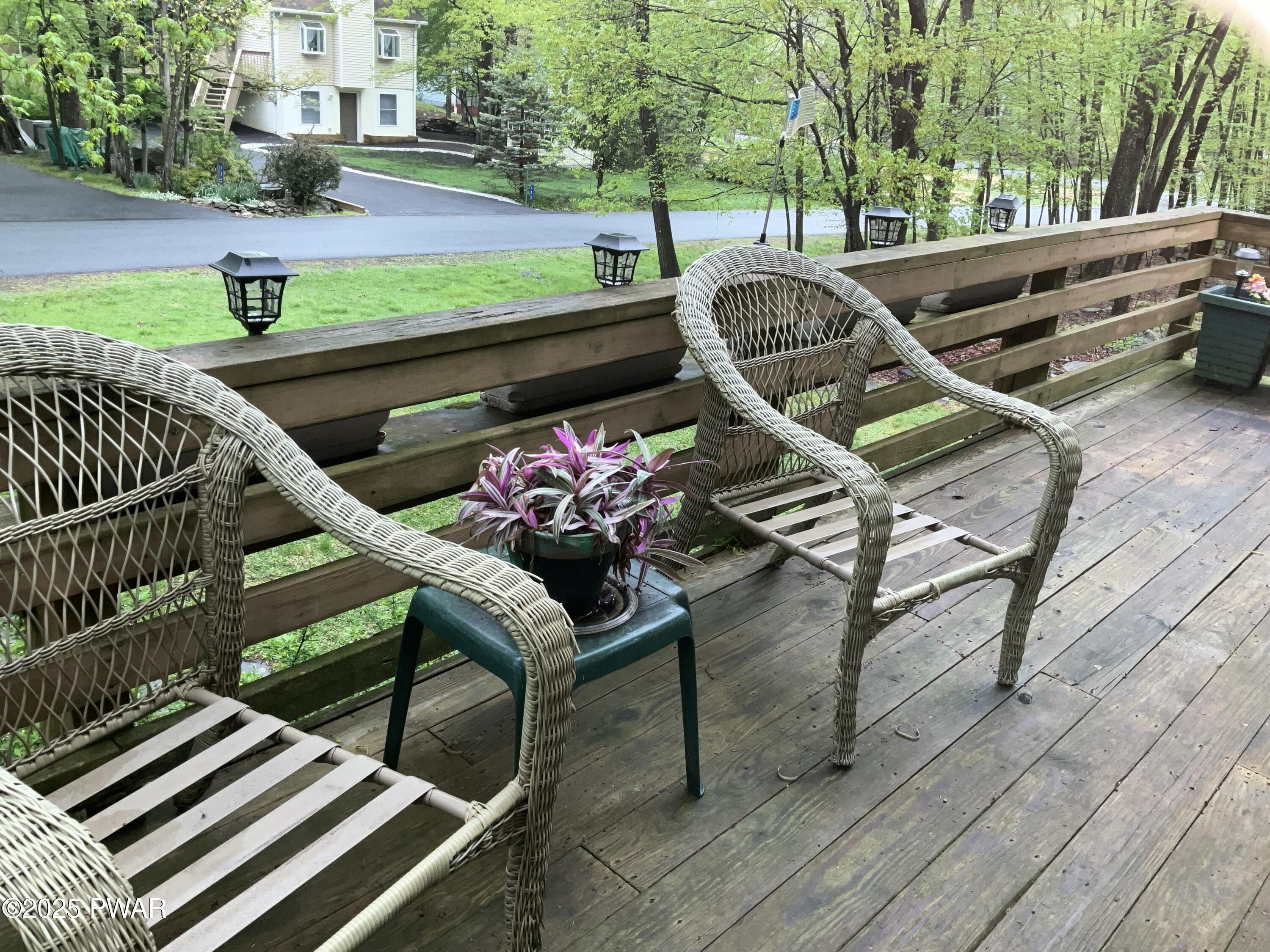 124 Roundhill Road Dingmans Ferry, PA 18328 - Photo 27 of 47 a view of a patio with a table and chairs
