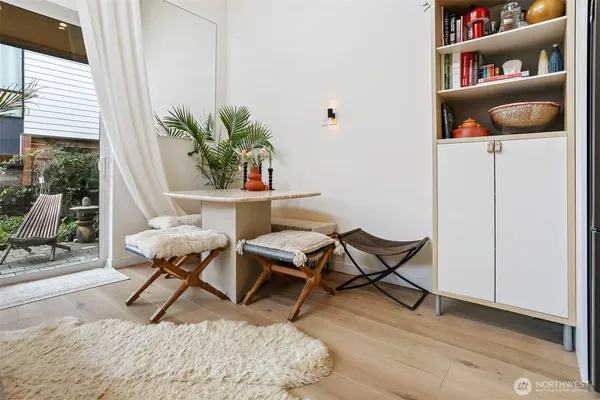 a living room with furniture and a potted plant