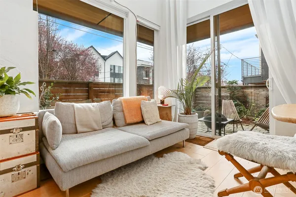 a living room with furniture and a large window