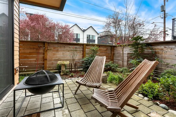 a view of balcony with two chairs and a table