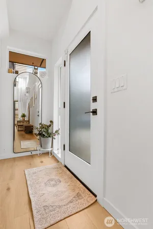 a view of a bathroom with tub shower and mirror