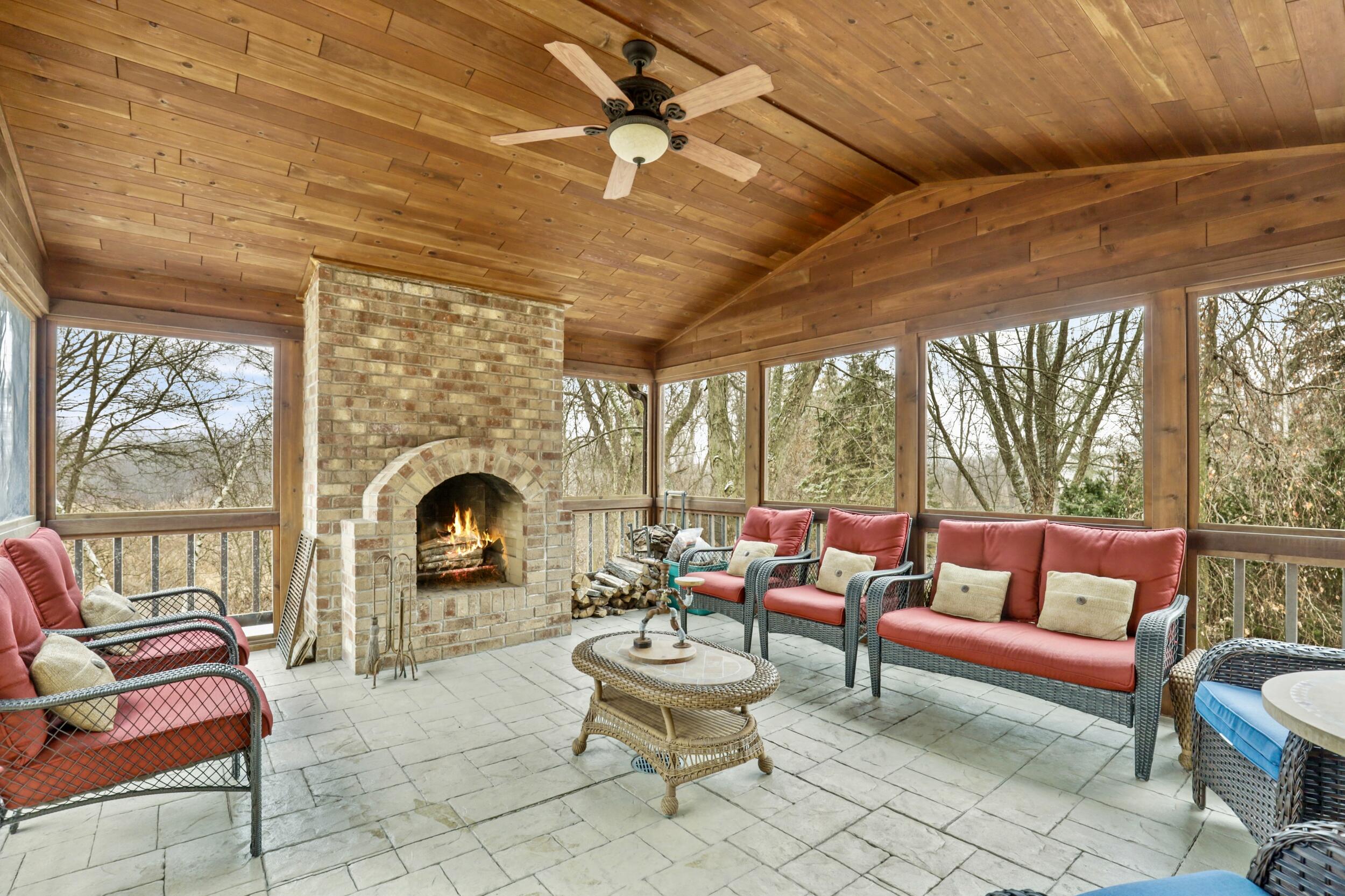 9210 County Rd K Raymond, WI 53126 - Photo 17 of 92 Screened Porch with Fireplace