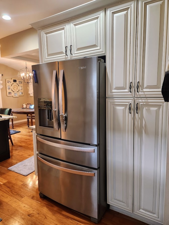 2246 Alta Vista Drive Waukegan, IL 60087 - Photo 18 of 46 a view of a refrigerator in kitchen and an empty room