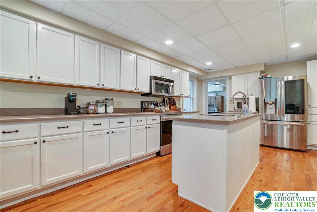 3585 Fairyland Road Lehighton, PA 18235 - Photo 11 of 67 a kitchen with stainless steel appliances granite countertop a refrigerator sink and microwave