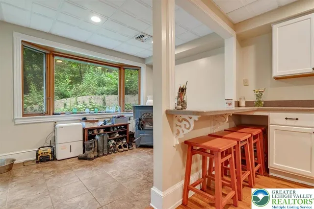 a view of a hallway with wooden floor and entryway