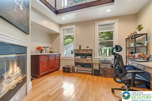 a view of an empty room and wooden floor