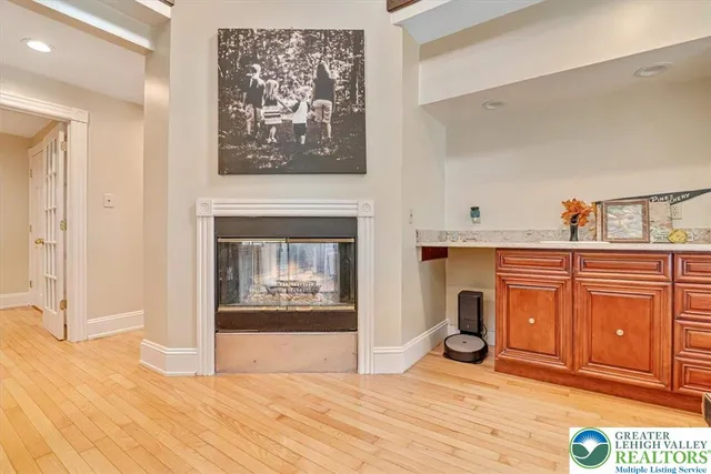 a view of a workspace with a window and lounge chair