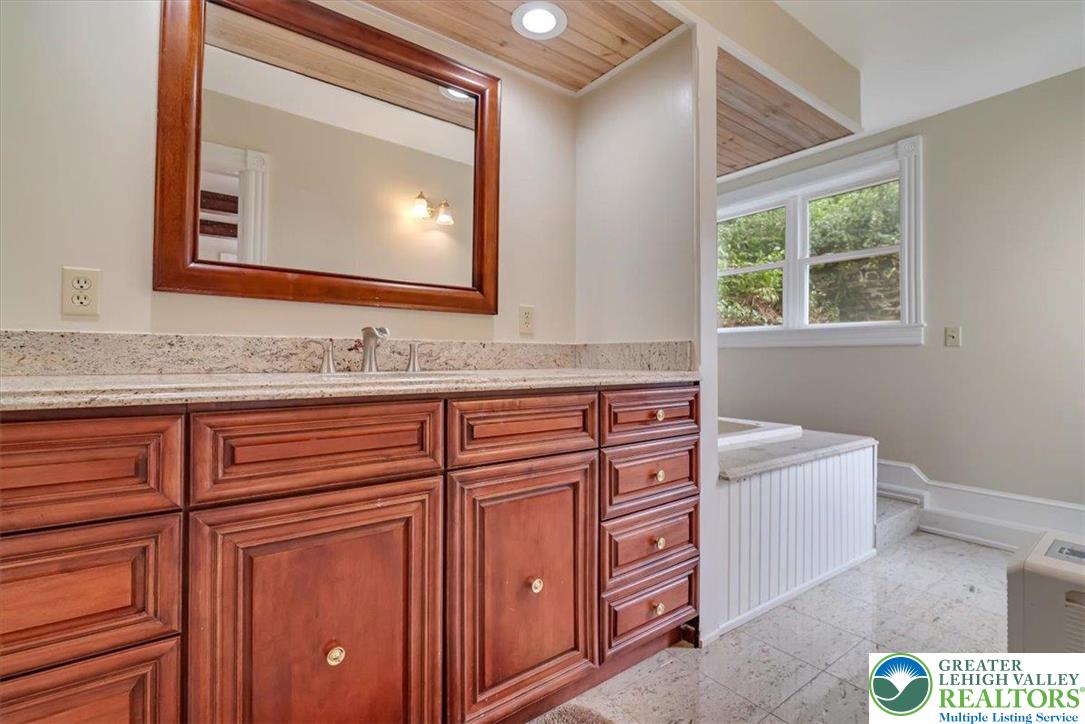 3585 Fairyland Road Lehighton, PA 18235 - Photo 19 of 67 a bathroom with a sink a vanity and a mirror