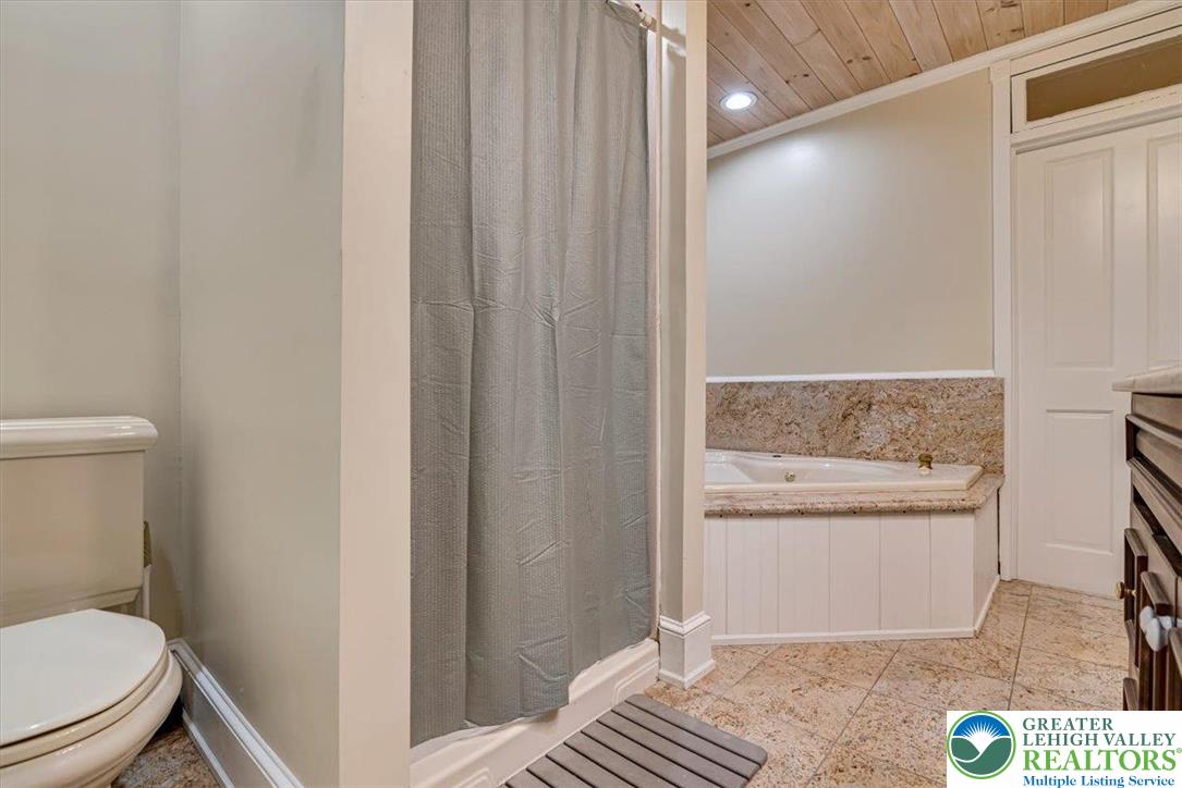 3585 Fairyland Road Lehighton, PA 18235 - Photo 32 of 67 a bathroom with a granite countertop sink and a toilet