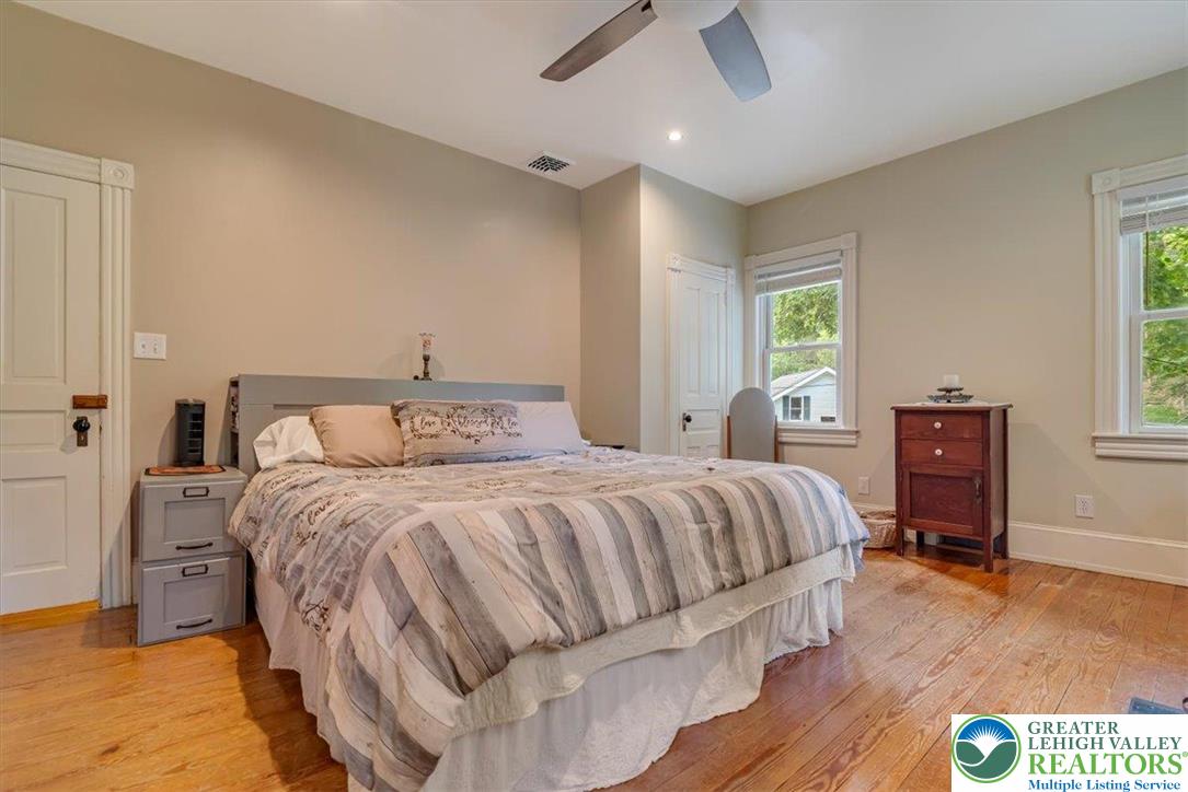 3585 Fairyland Road Lehighton, PA 18235 - Photo 33 of 67 a bedroom with a bed and wooden floor