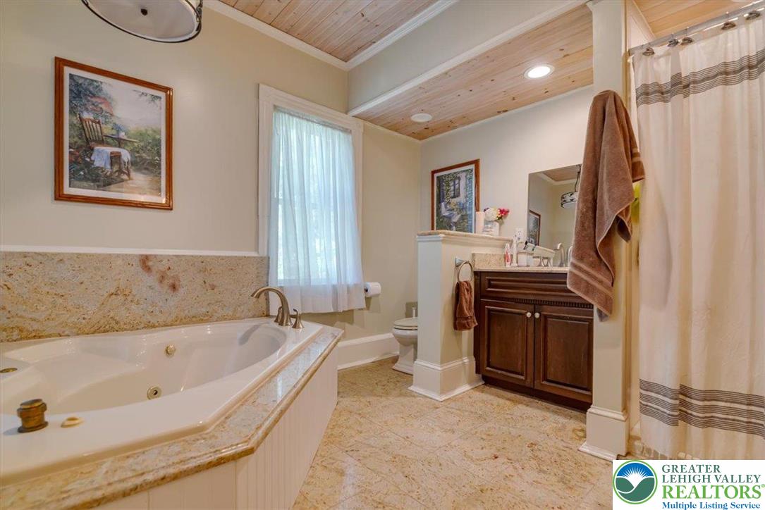 3585 Fairyland Road Lehighton, PA 18235 - Photo 34 of 67 a spacious bathroom with a tub sink and mirror