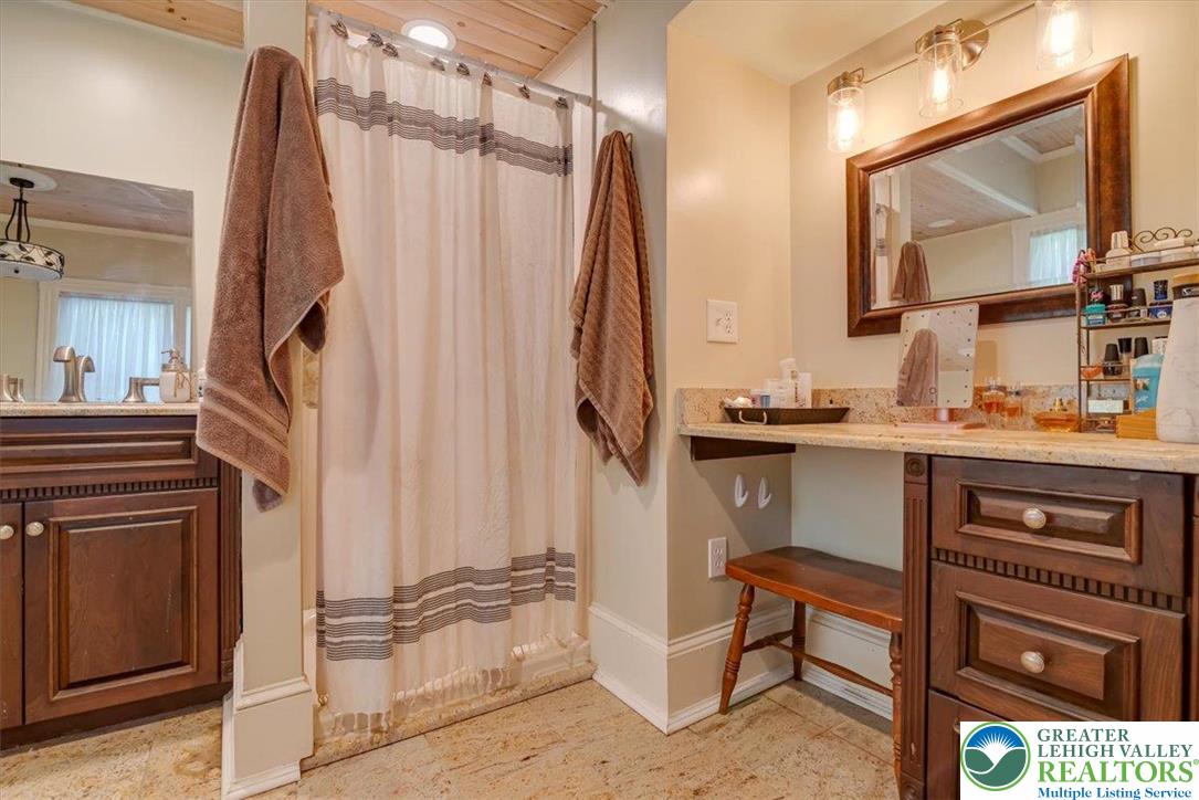 3585 Fairyland Road Lehighton, PA 18235 - Photo 36 of 67 a bathroom with a sink a mirror and a shower
