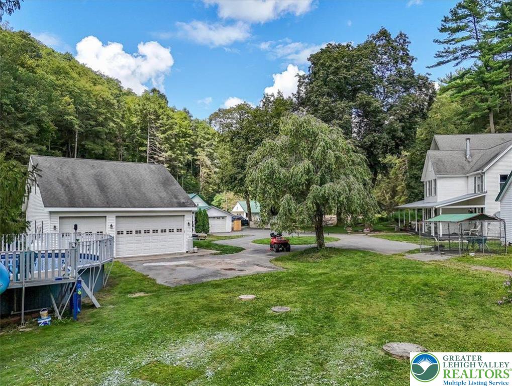 3585 Fairyland Road Lehighton, PA 18235 - Photo 47 of 67 a view of a house with a backyard and a tree