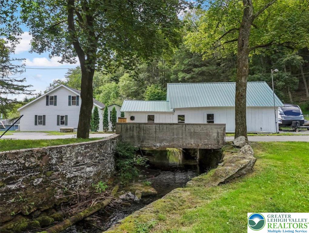 3585 Fairyland Road Lehighton, PA 18235 - Photo 48 of 67 a aerial view of a house with a yard table and chairs