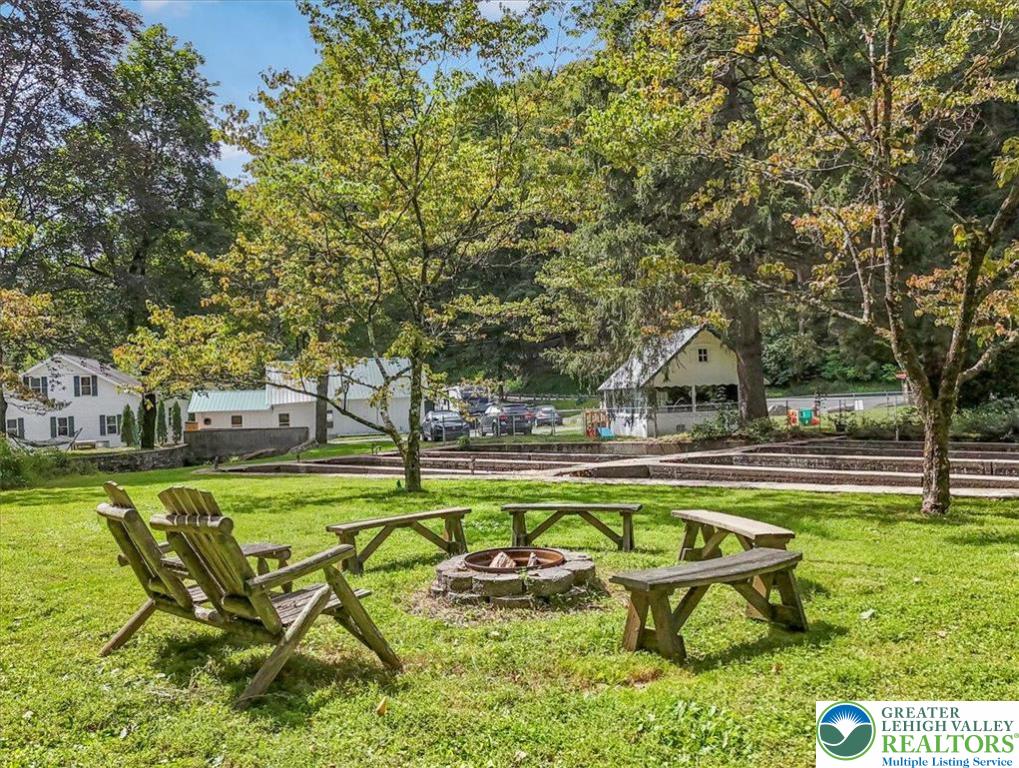 3585 Fairyland Road Lehighton, PA 18235 - Photo 49 of 67 a swimming pool with outdoor seating and yard