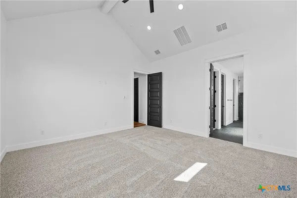 a view of an empty room with glass door