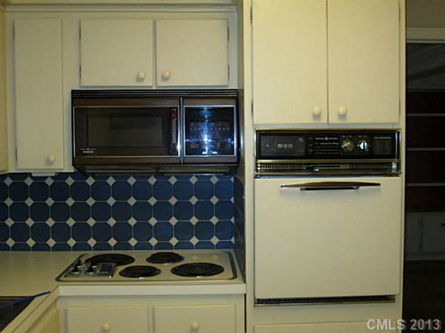 500 Ashworth Road Charlotte, NC 28211 - Photo 5 of 12 a kitchen with a stove and a microwave