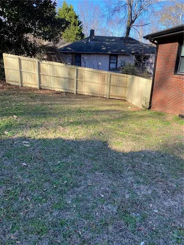 a view of a backyard of the house