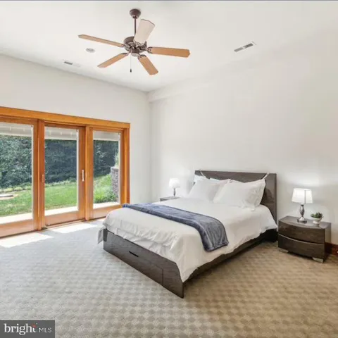 a kitchen with stainless steel appliances kitchen island granite countertop a sink and a wooden cabinets