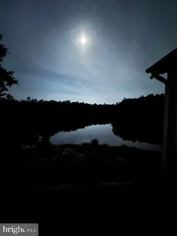 a view of a lake from a yard