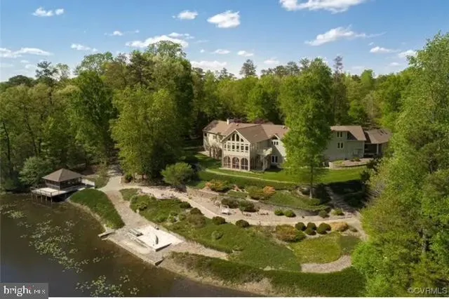 aerial view of a house with a yard
