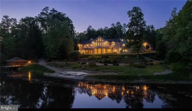 a view of a back yard of a house and green space