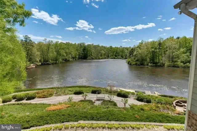 an aerial view of a houses with lake view