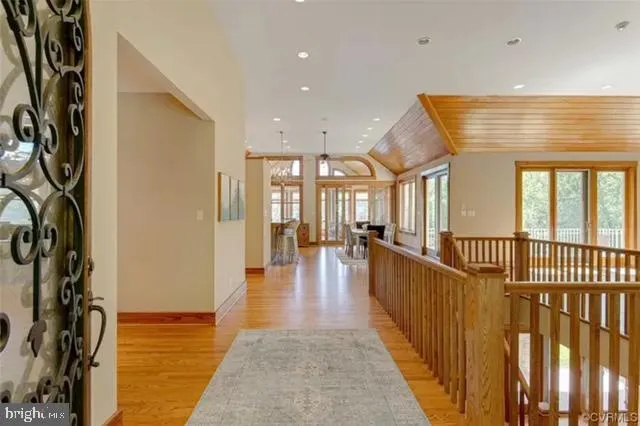 a view of a livingroom with furniture and floor to ceiling window