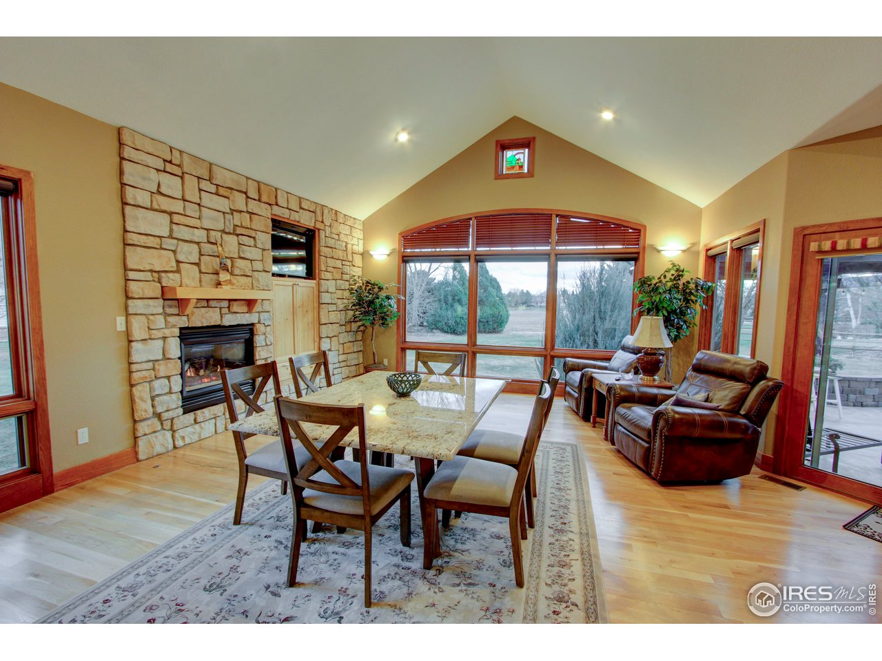 7848 Eagle Ranch Road Fort Collins, CO 80528 - Photo 14 of 46 a dining room with furniture and wooden floor