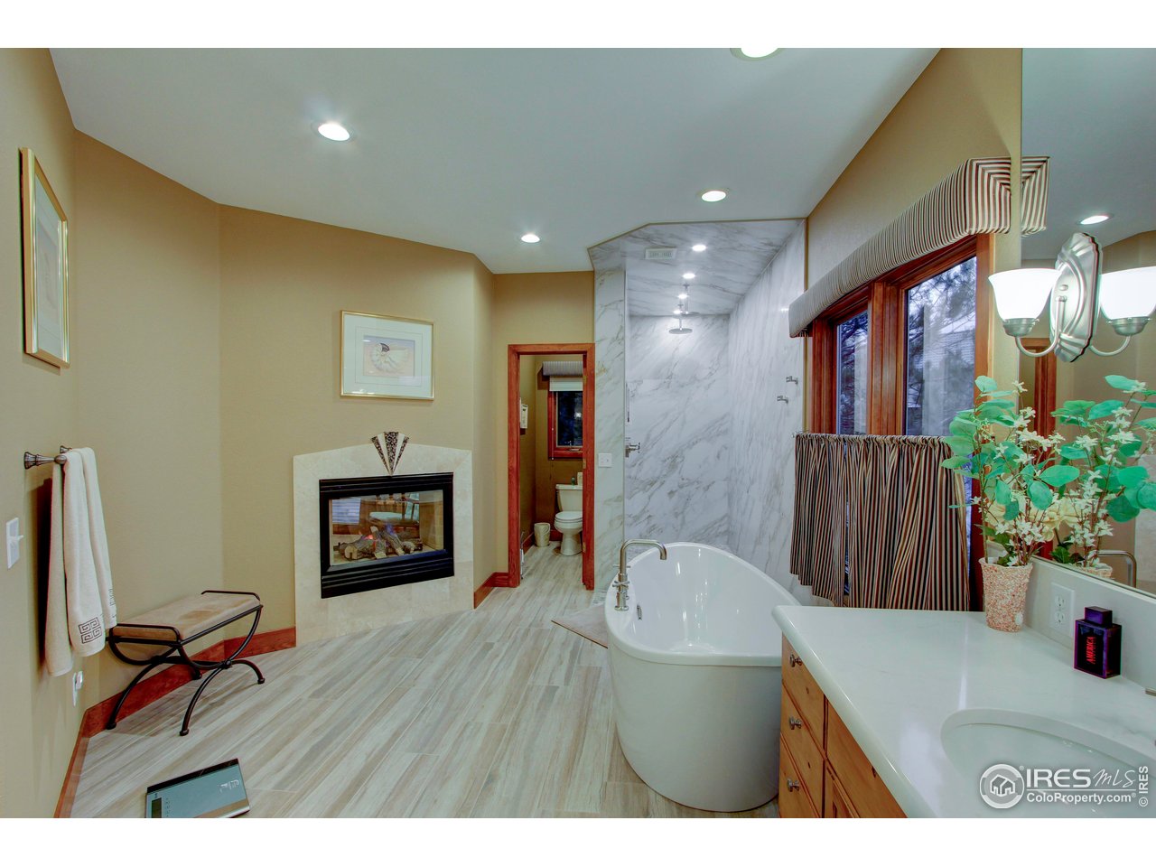 7848 Eagle Ranch Road Fort Collins, CO 80528 - Photo 19 of 46 a living room with furniture and a fireplace