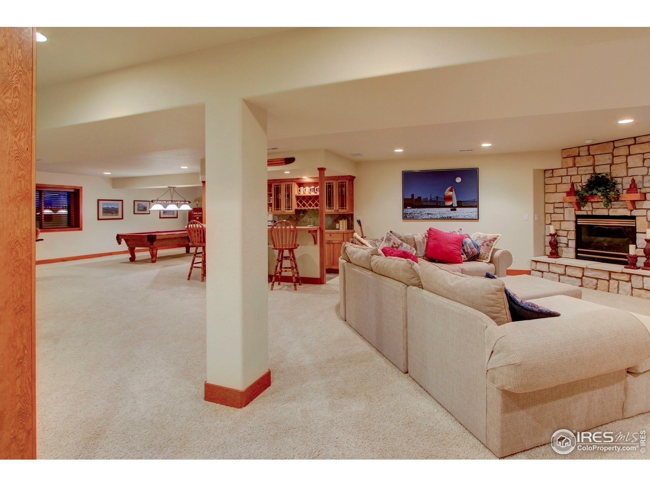 7848 Eagle Ranch Road Fort Collins, CO 80528 - Photo 26 of 46 a living room with furniture and a flat screen tv